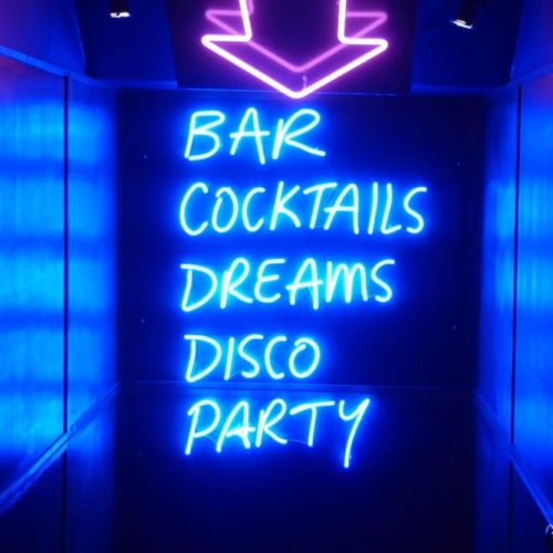 Manchester hidden venues neon bar sign